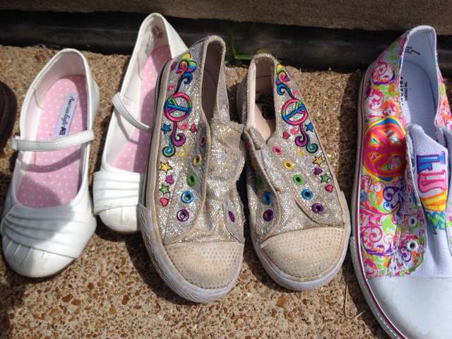 Pairs of childrens shoes lined up