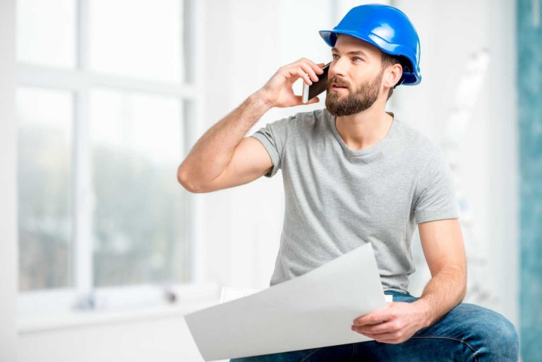 Construction worker talking on phone