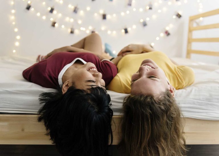 Two girls laying down