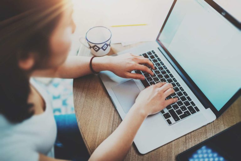 Lady typing on computer