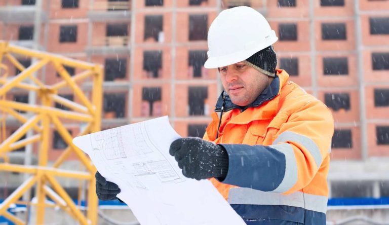 Man examining blueprint