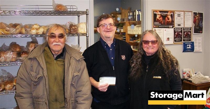 The Salvation Army in Burlington accepting a donation from StorageMart.