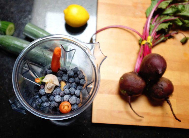 Fruits and Vegetables entering blender