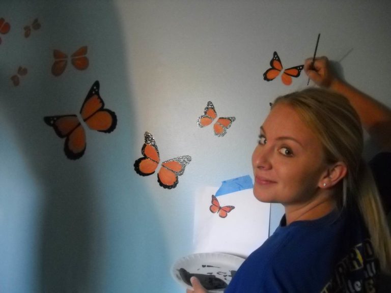 Girl painting a butterfly