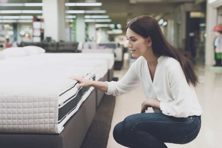 Lady testing mattress quality