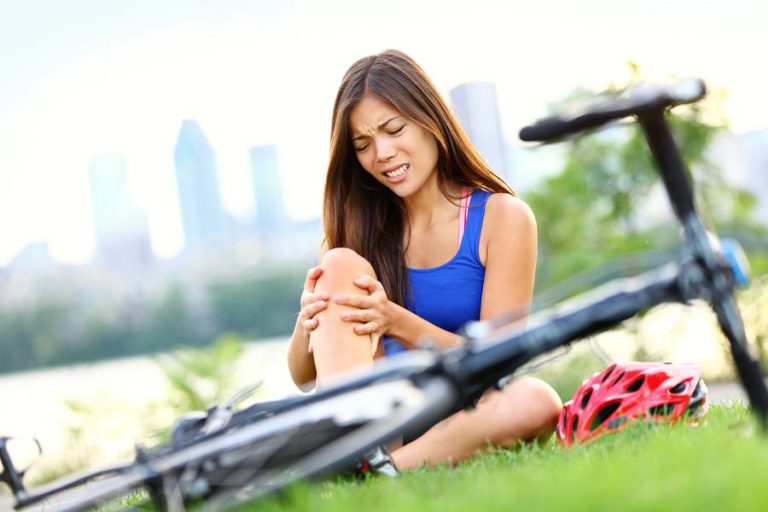 Lady suffering injury from cycling