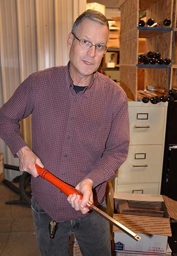 Dan demonstrates the correct grip with one of the many custom chisels the company sells.