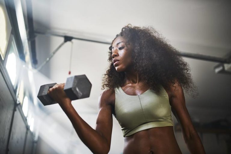 Lady working out in home garage gym