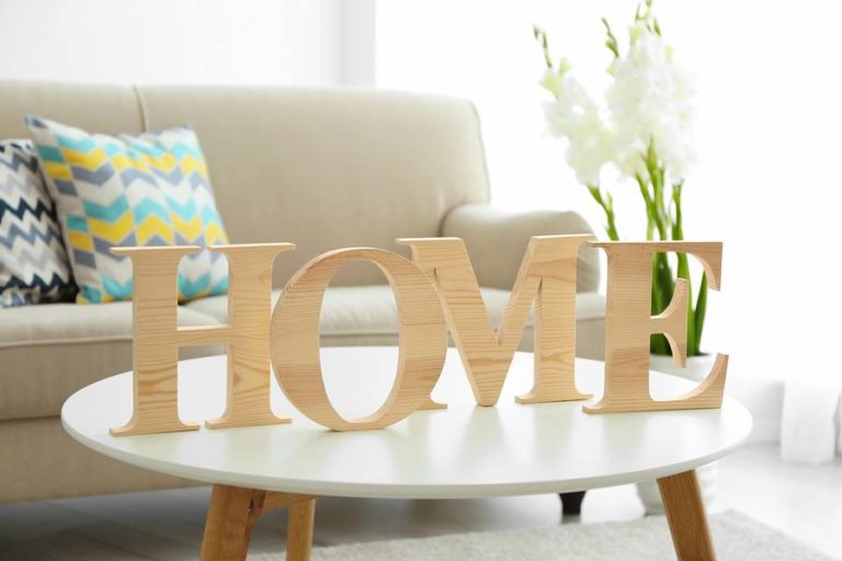 Decorative home sign displayed on living room table