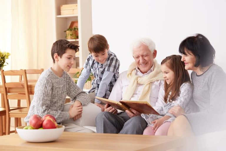 Grandpa reading book to children