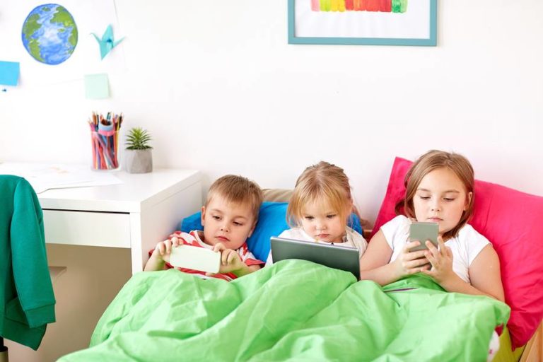 Three kids participating in screen time