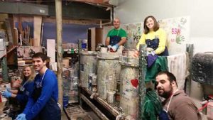 Group of volunteers recycling paint