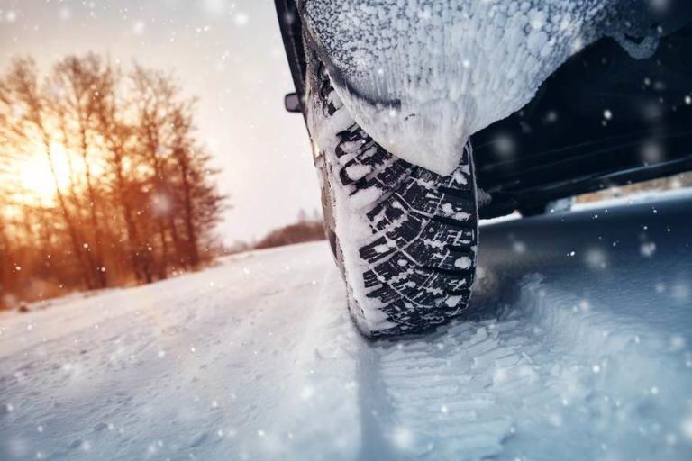 Car driving through a snowy road