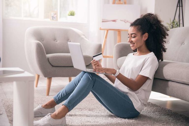 Lady preparing to buy on her laptop