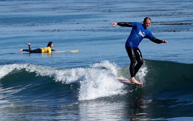 Person surfing miniature wave