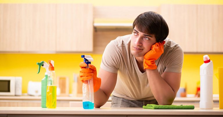 A man prepares to clean his home.