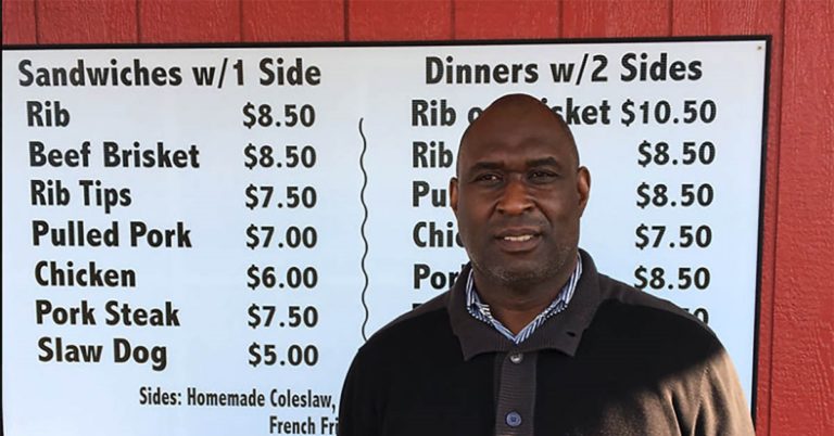 Owner Lloyd Jr. in front of his restaurant