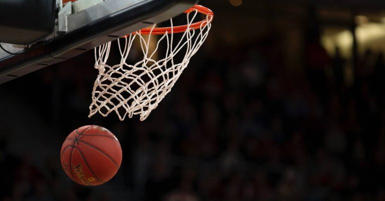 A basketball going through the net