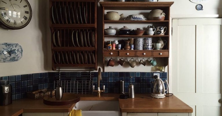 a small kitchen using wall space for organization