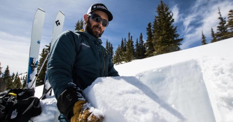 A Friends of Colorado Avalanche Information Center volunteer on a ski mountain.