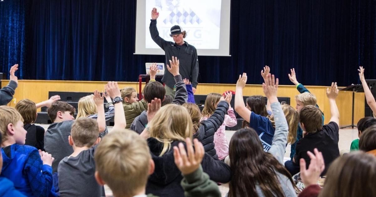 Friends of Colorado Avalanche Information Center volunteer giving a presentation to students.