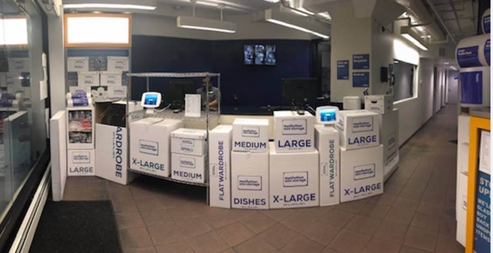 Team members at Manhattan Mini Storage used boxes and shelving to create counter extensions to help customers check-in while social distancing.